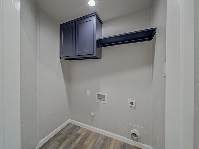 clothes washing area featuring hookup for a gas dryer, electric dryer hookup, hookup for a washing machine, and dark wood-type flooring