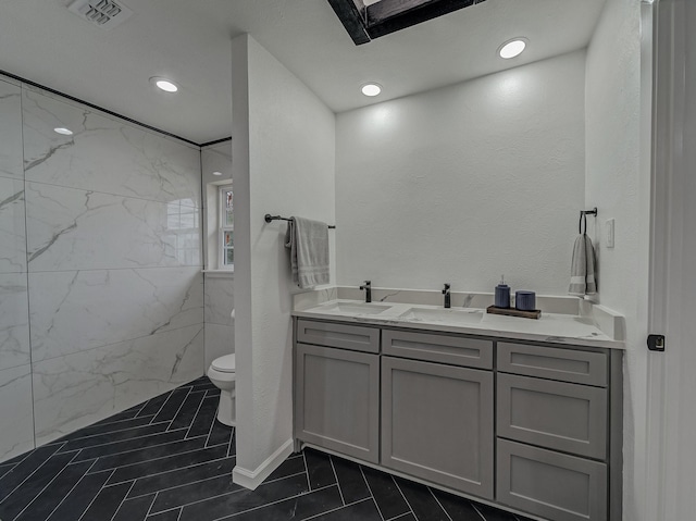 bathroom featuring vanity and toilet