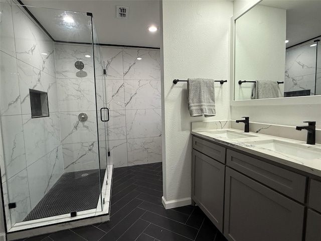 bathroom with vanity and an enclosed shower