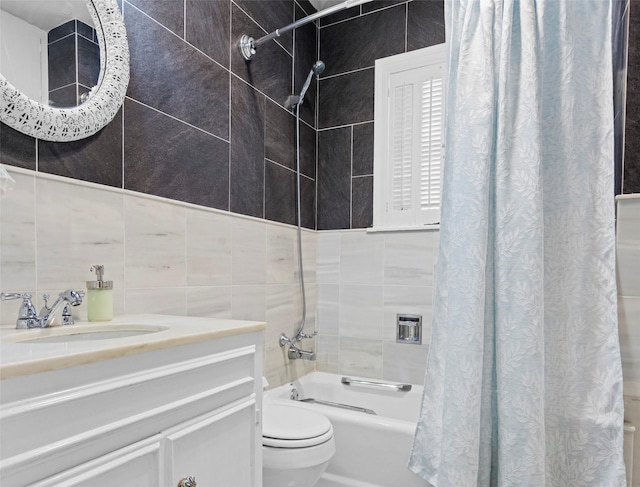 full bathroom featuring vanity, tile walls, shower / bath combination with curtain, and toilet