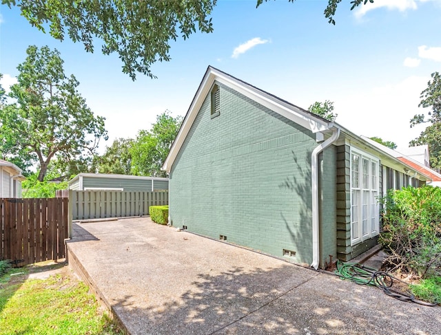 view of home's exterior with a patio