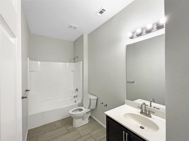 full bathroom featuring vanity, toilet, and washtub / shower combination