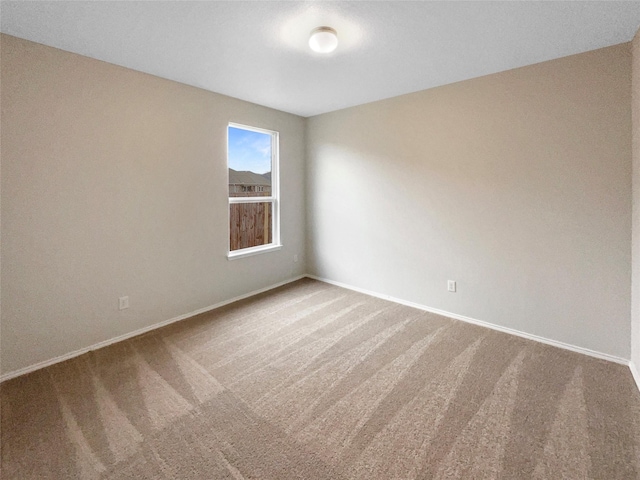 unfurnished room with carpet flooring