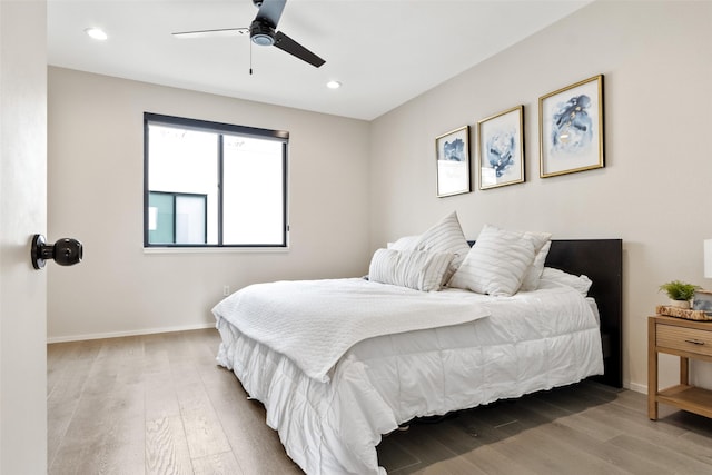 bedroom featuring ceiling fan and hardwood / wood-style floors