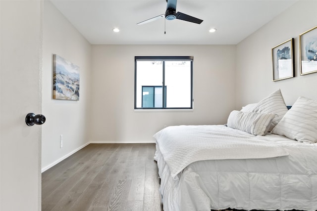 bedroom featuring hardwood / wood-style flooring and ceiling fan