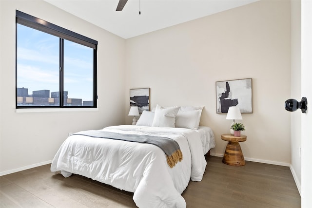 bedroom with hardwood / wood-style flooring and ceiling fan