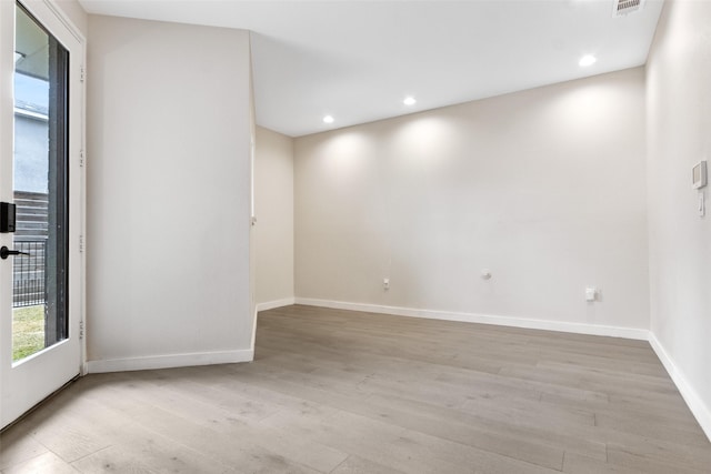 unfurnished room featuring light wood-type flooring