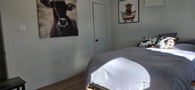 bedroom with hardwood / wood-style flooring