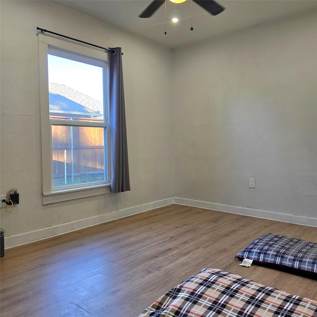 unfurnished bedroom featuring ceiling fan and light wood-type flooring