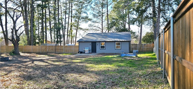 rear view of property with a lawn