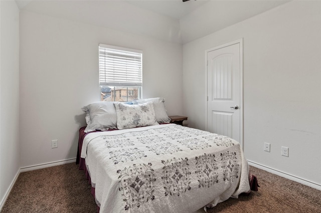 bedroom with dark colored carpet