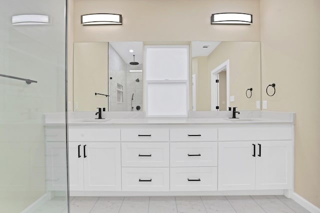 bathroom featuring vanity and an enclosed shower