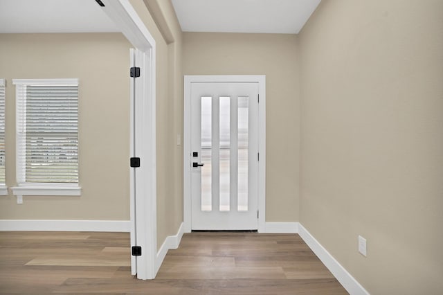 foyer entrance with light hardwood / wood-style flooring