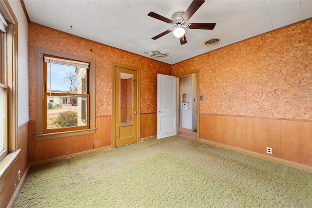 unfurnished room featuring ceiling fan