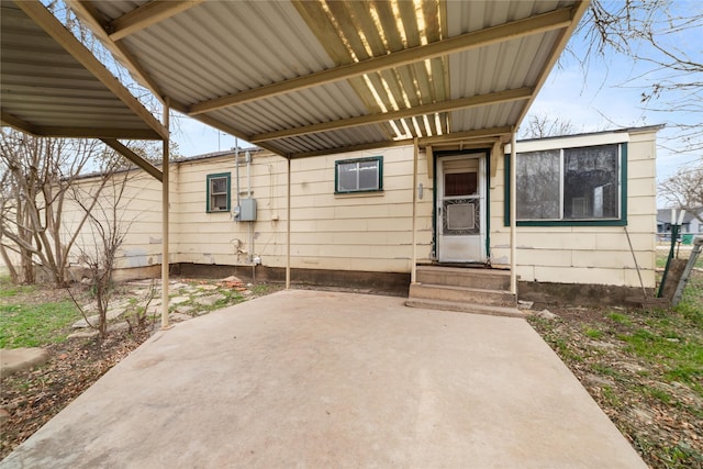 entrance to property featuring a patio