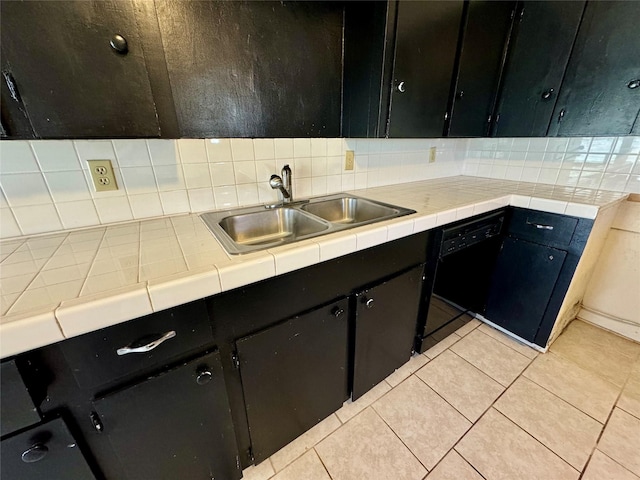 kitchen with tasteful backsplash, light tile patterned flooring, sink, and dishwasher