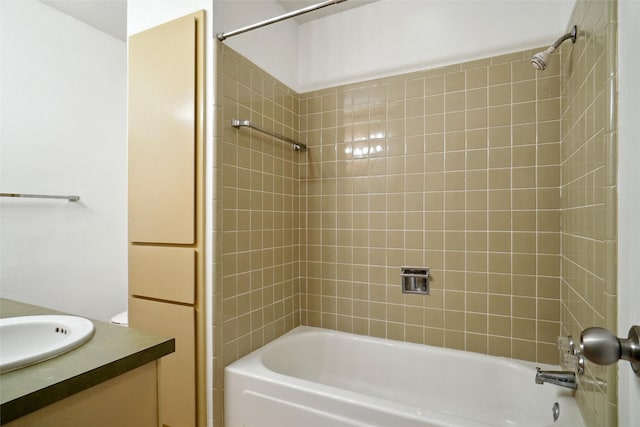 bathroom featuring vanity and tiled shower / bath combo