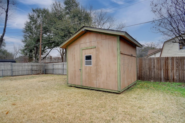 view of outbuilding with a yard