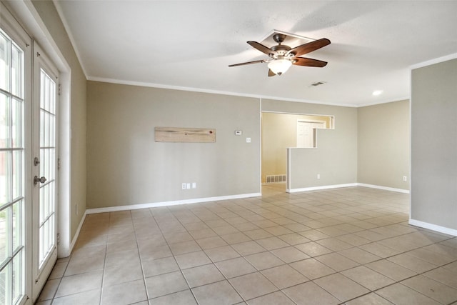 tiled spare room with crown molding, french doors, and ceiling fan