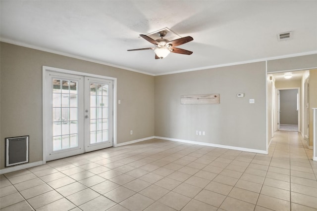 tiled empty room with crown molding, ceiling fan, and french doors