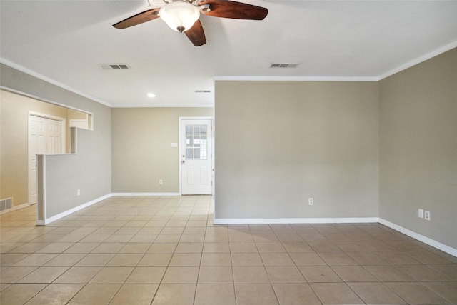 tiled empty room with crown molding and ceiling fan