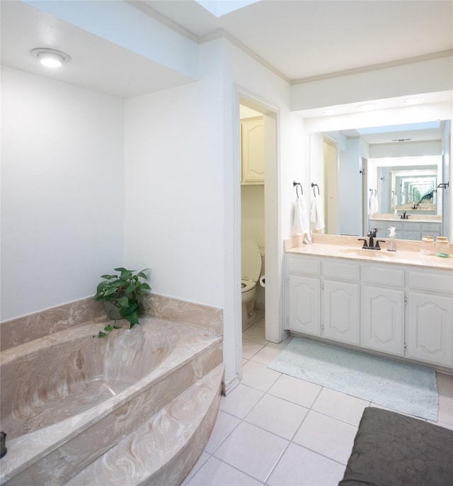 bathroom with tile patterned floors, toilet, crown molding, vanity, and a washtub