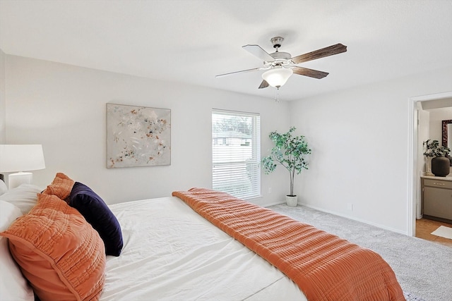 bedroom featuring light carpet and ceiling fan