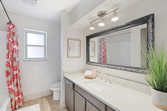 full bathroom featuring shower / bath combination with curtain, tile patterned floors, vanity, and toilet