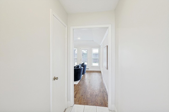 corridor with light tile patterned floors