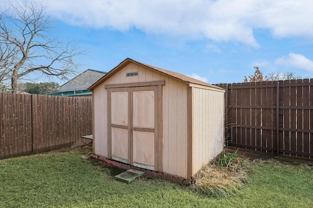 view of outbuilding with a lawn