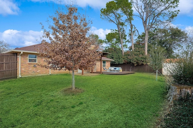 view of yard with a wooden deck