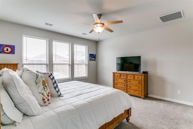 bedroom with light colored carpet and ceiling fan