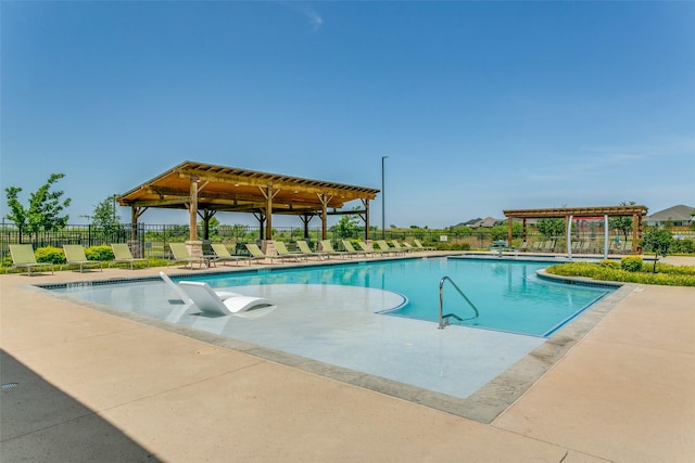 view of swimming pool featuring a pergola and a patio area