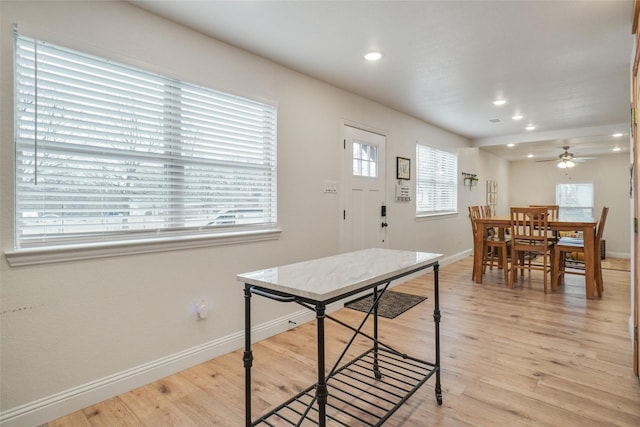 dining space with recessed lighting, light wood-type flooring, and baseboards