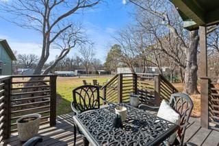 deck with outdoor dining space