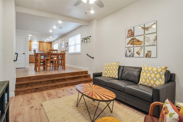 living area with recessed lighting, light wood-style flooring, ceiling fan, and baseboards