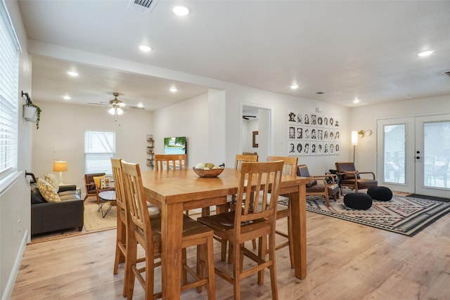 dining space featuring visible vents, recessed lighting, french doors, and light wood-type flooring