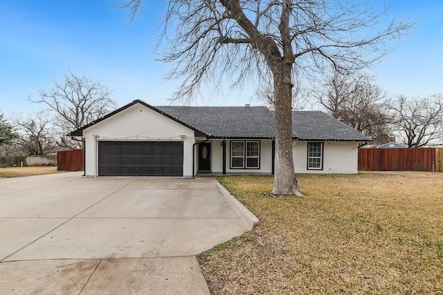 ranch-style home with a garage, driveway, a front yard, and fence