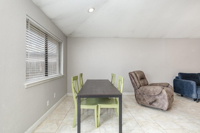 dining area with lofted ceiling