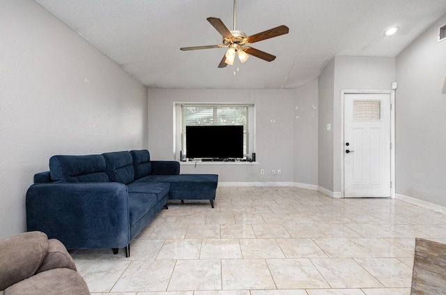 living room featuring vaulted ceiling and ceiling fan