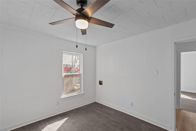 unfurnished room featuring ceiling fan and dark hardwood / wood-style floors