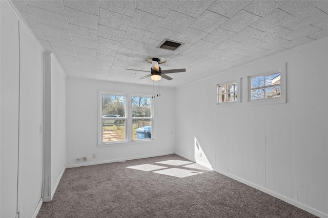 spare room with carpet and ceiling fan