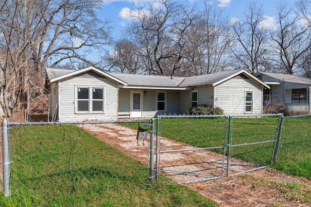 ranch-style home featuring a front lawn