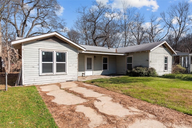 ranch-style house featuring a front lawn