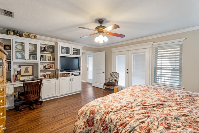 bedroom with ornamental molding, access to exterior, dark wood-type flooring, a textured ceiling, and french doors