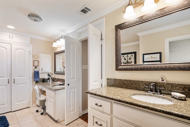 bathroom featuring ornamental molding, vanity, and tile patterned floors