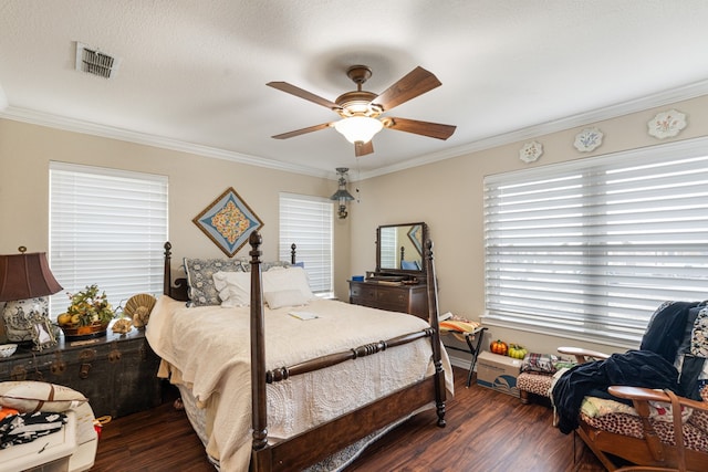 bedroom featuring crown molding, dark hardwood / wood-style floors, and ceiling fan