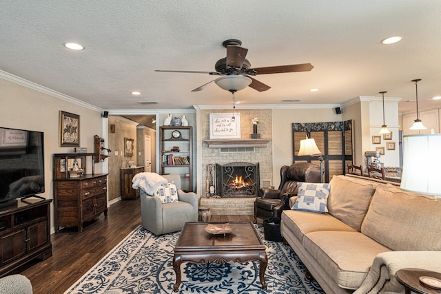 living room with crown molding, ceiling fan, dark hardwood / wood-style floors, and a textured ceiling