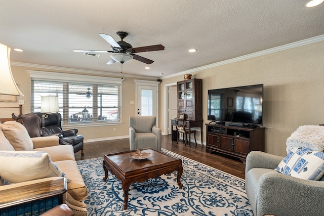 living room featuring crown molding, dark hardwood / wood-style floors, ceiling fan, and a textured ceiling