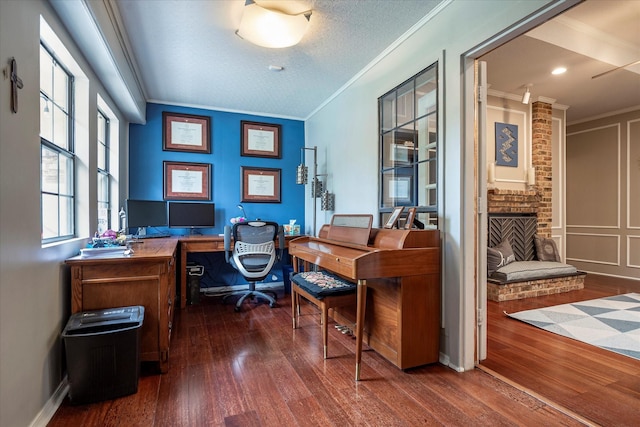 office space featuring a brick fireplace, dark wood-type flooring, and ornamental molding